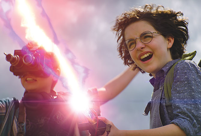 A kid with funky glasses and another kid shooting a laser beam
